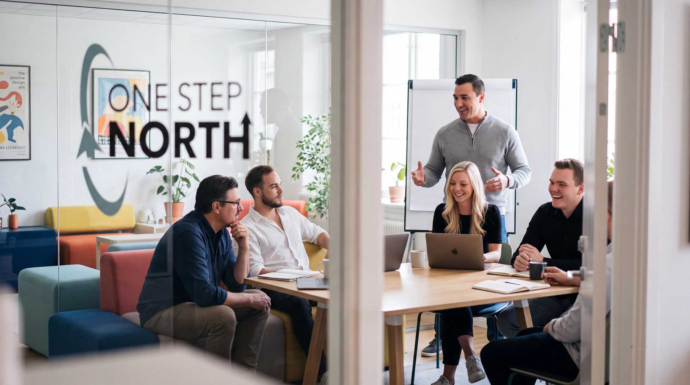 The One Step North team working together in the studio